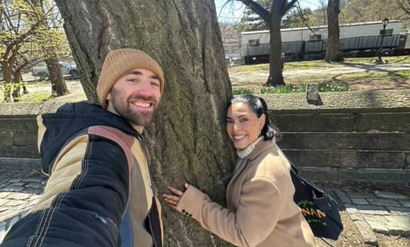 Jacob and Jasmine hugging a tree